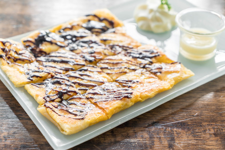 roti with chocolate sauce in plateの写真素材