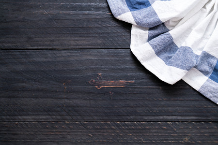kitchen cloth (napkin) on wood background with copy spaceの写真素材