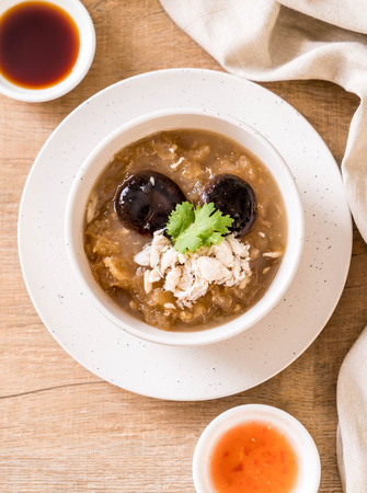Braised Fish Maw in Red Gravy Soup with Crab in bowlの写真素材