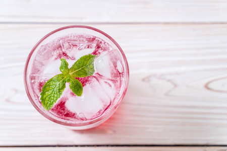 iced strawberry soda on wood tableの写真素材