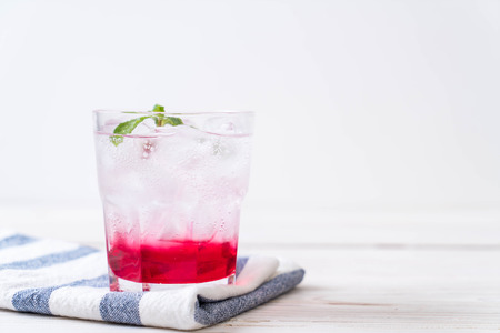 iced strawberry soda on wood tableの写真素材