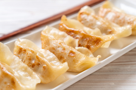 Japanese gyoza or dumplings snack with soy sauceの写真素材