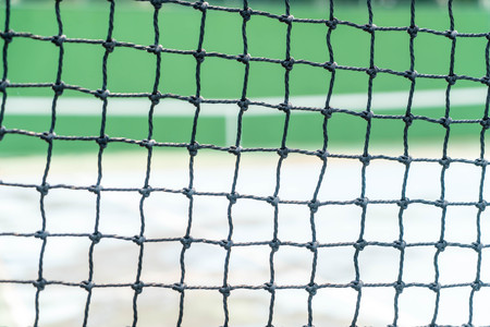 tennis net with empty tennis court backgroundの写真素材