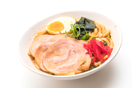 spicy miso udon ramen noodle with pork isolated on white backgroundの写真素材