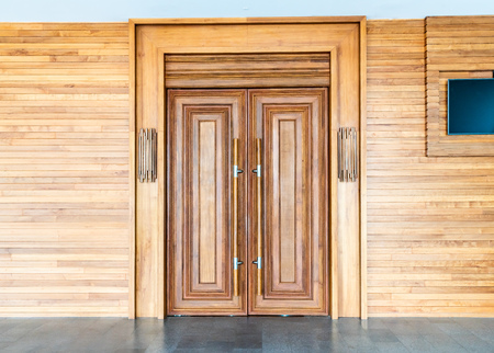 wood door on wall - vintage effect filterの写真素材