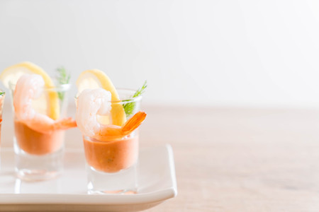 shrimp cocktail with sauce on table