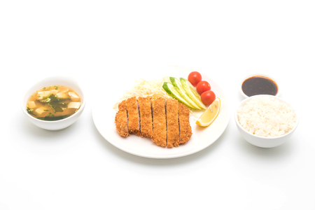 Japanese deep fried pork cutlet (tonkatsu set) isolated on white backgroundの写真素材