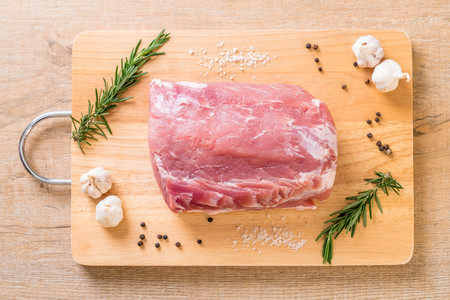 fresh pork raw fillet on wooden boardの写真素材