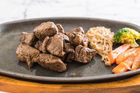 beef steak with vegetable on the tableの写真素材