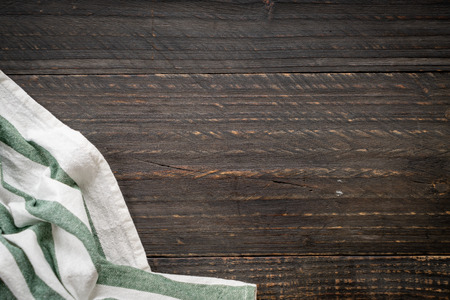 kitchen cloth (napkin) on wood background - vintage effect filter