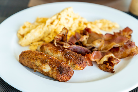 Sausage Bacon and  Scrambled Eggs for breakfastの写真素材