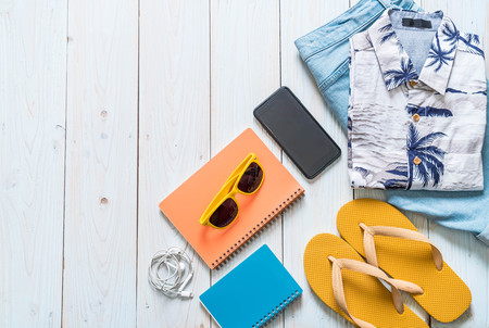 men's casual outfits of traveler, summer holiday on wood backgroundの写真素材