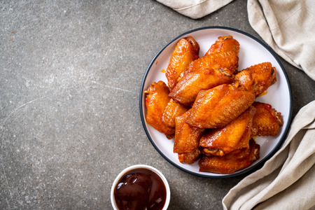 barbecue chicken wings with sauceの写真素材