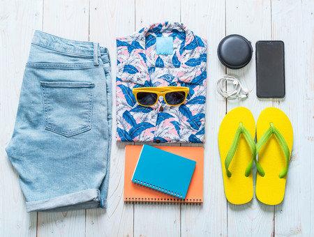 men's casual outfits of traveler, summer holiday on wood backgroundの写真素材