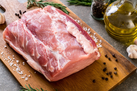 fresh pork raw fillet on wooden boardの写真素材