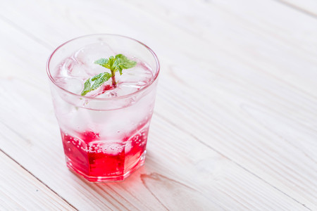 iced strawberry soda on wood tableの写真素材