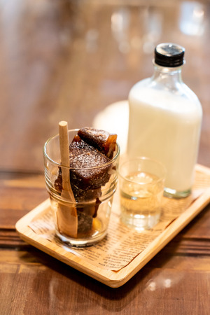 iced coffee cube in glass with milk - vintage effect filterの写真素材