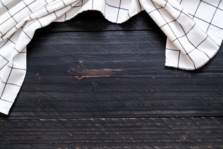 kitchen cloth (napkin) on wood background with copy spaceの写真素材