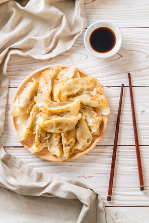 Japanese gyoza or dumplings snack with soy sauceの写真素材