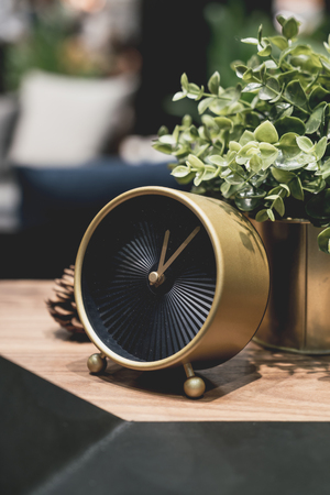 beautiful golden clock decoration on table