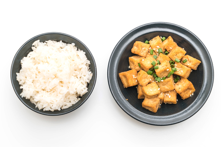 Fried Tofu in a bowl with sesame isolated on white backgroundの写真素材