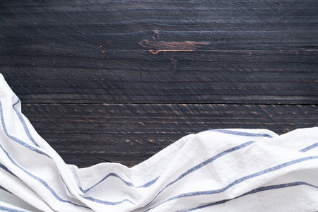 kitchen cloth (napkin) on wood background with copy space
