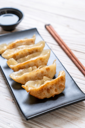 Japanese gyoza or dumplings snack with soy sauceの写真素材
