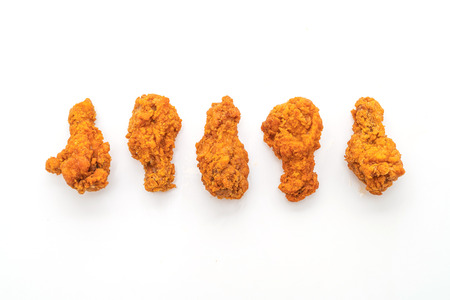 fried spicy chicken wings isolated on white backgroundの写真素材