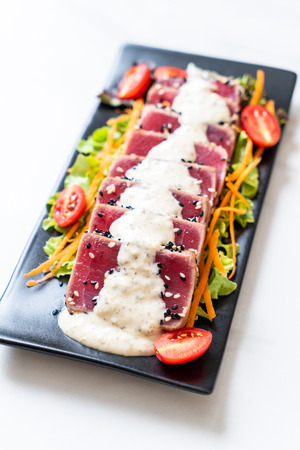 fresh tuna raw with vegetable salad and sauce - healthy foodの写真素材