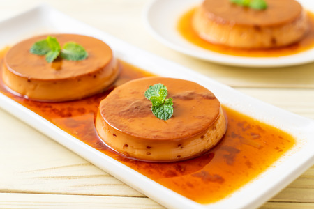 homemade caramel custard pudding on wood background