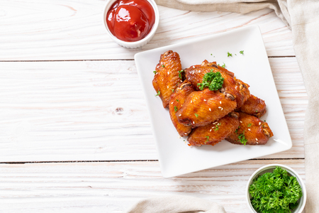 baked barbecue chicken wings with white sesameの写真素材
