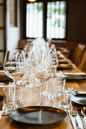empty glass on dining table set - selective focus pointの写真素材