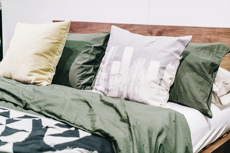 beautiful and comfortable pillow decoration on bed - vintage effect filterの写真素材