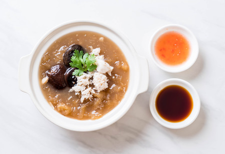 Braised Fish Maw in Red Gravy Soup with Crab in bowlの写真素材