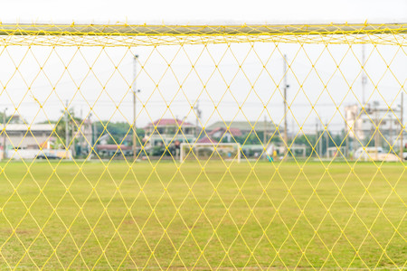 A soccer goal on green empty football fieldの写真素材