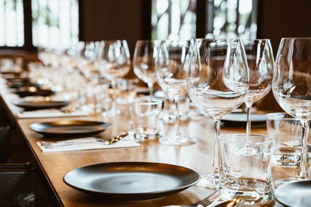 empty glass on dining table set - selective focus pointの写真素材