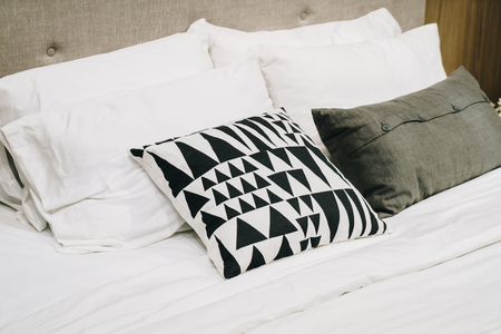 beautiful and comfortable pillow decoration on bed - vintage effect filterの写真素材