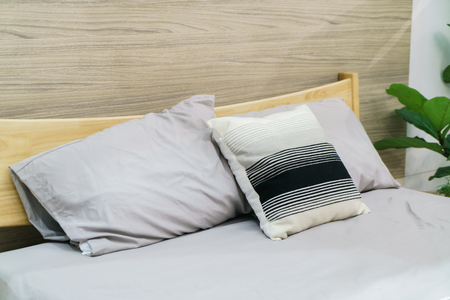 beautiful and comfortable pillow decoration on bed - vintage effect filterの写真素材