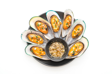 seafood mussels with lemon and parsley isolated on white background