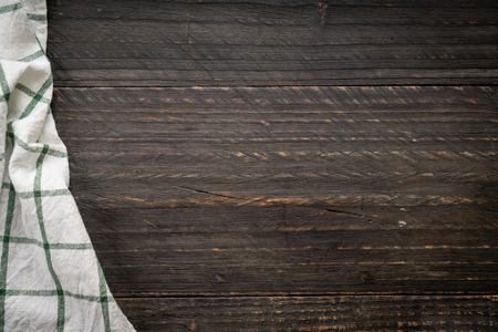 kitchen cloth (napkin) on wood background - vintage effect filterの写真素材