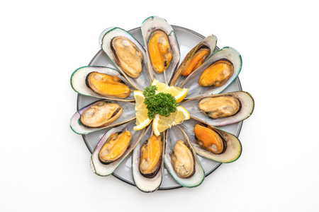 seafood mussels with lemon and parsley isolated on white background