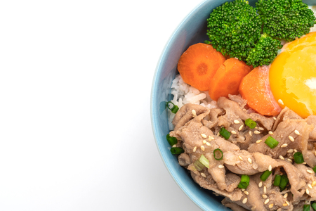 donburi, pork rice bowl with onsen egg and vegetable isolated on white backgroundの写真素材