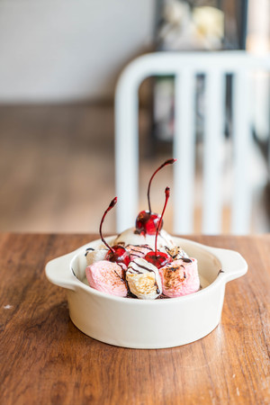 baked marshmallow and chocolate brownies with ice-cream bowlの写真素材