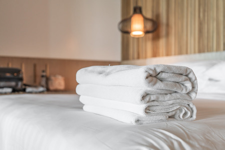 White towel on bed in hotel and resortの写真素材