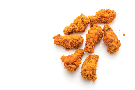 fried spicy chicken wings isolated on white backgroundの写真素材