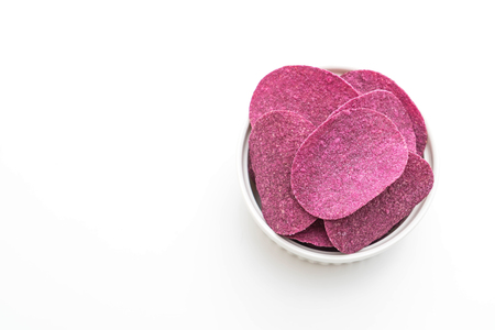 sweet potato chips isolated on white backgroundの写真素材