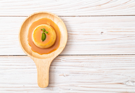 homemade caramel custard pudding with mintの写真素材