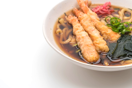 udon ramen noodles with shrimps tempura isolated on white backgroundの写真素材