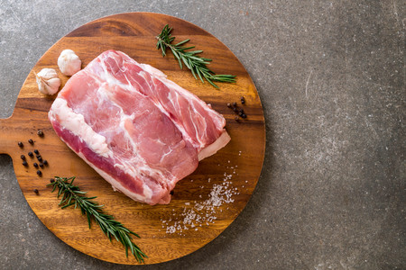 fresh pork raw fillet on wooden boardの写真素材