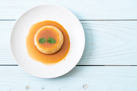 homemade caramel custard pudding with mintの写真素材